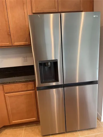 a view of a large kitchen with a sink and a stove