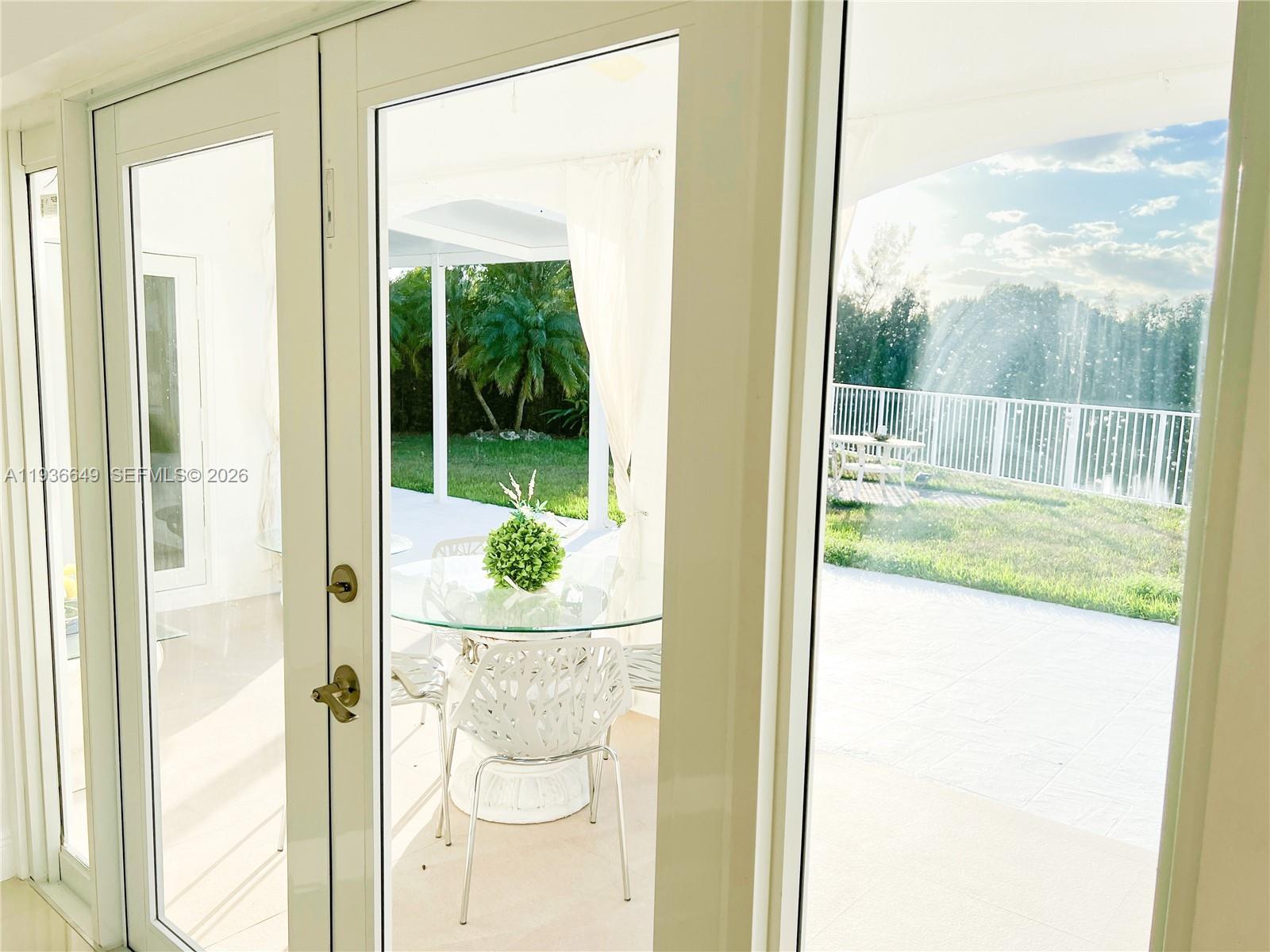 3884 Southwest 150th Court Miami, FL 33185 - Photo 14 of 45 a view of a glass door and porch