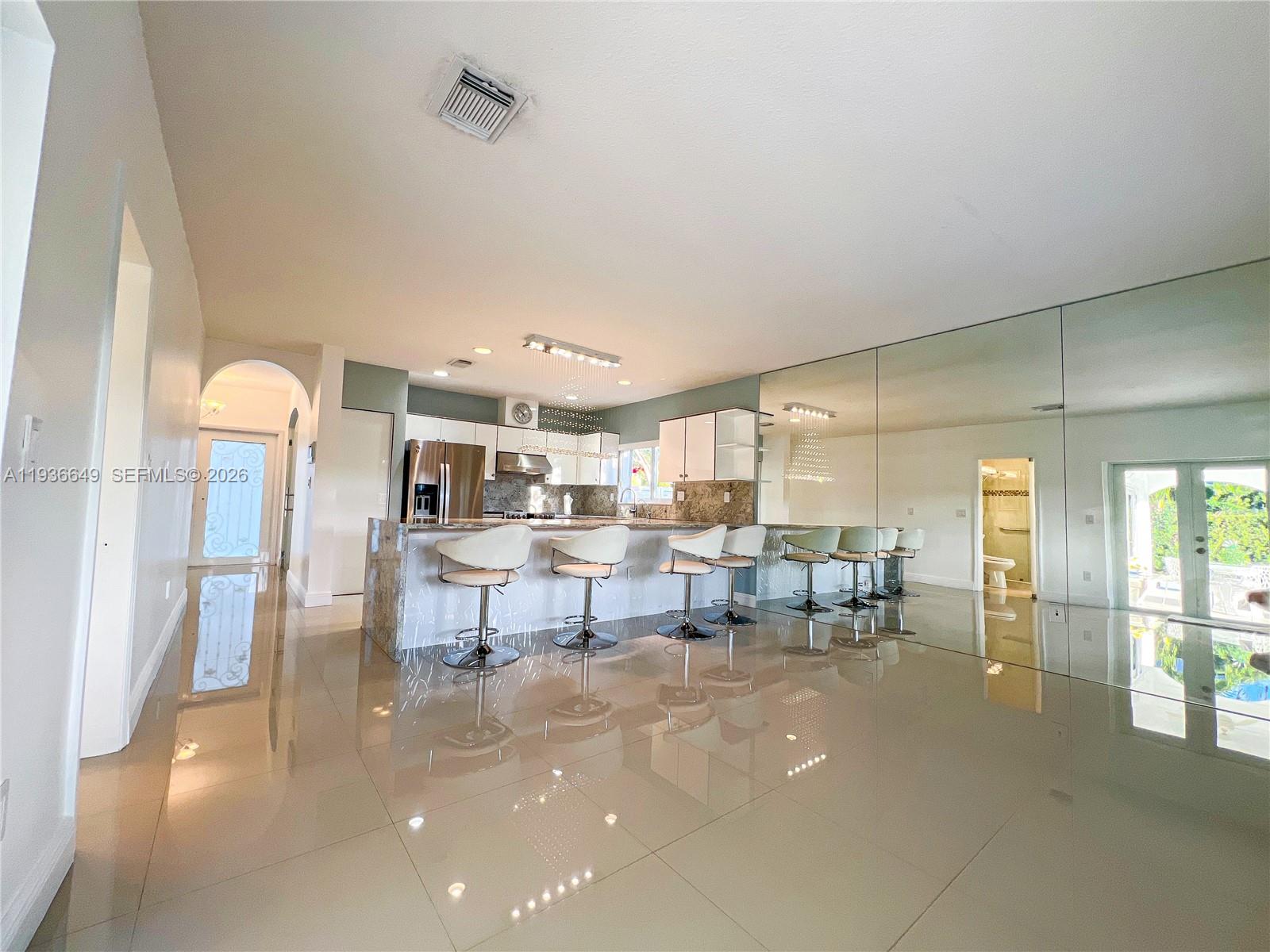 3884 Southwest 150th Court Miami, FL 33185 - Photo 16 of 45 a living room with furniture and a table