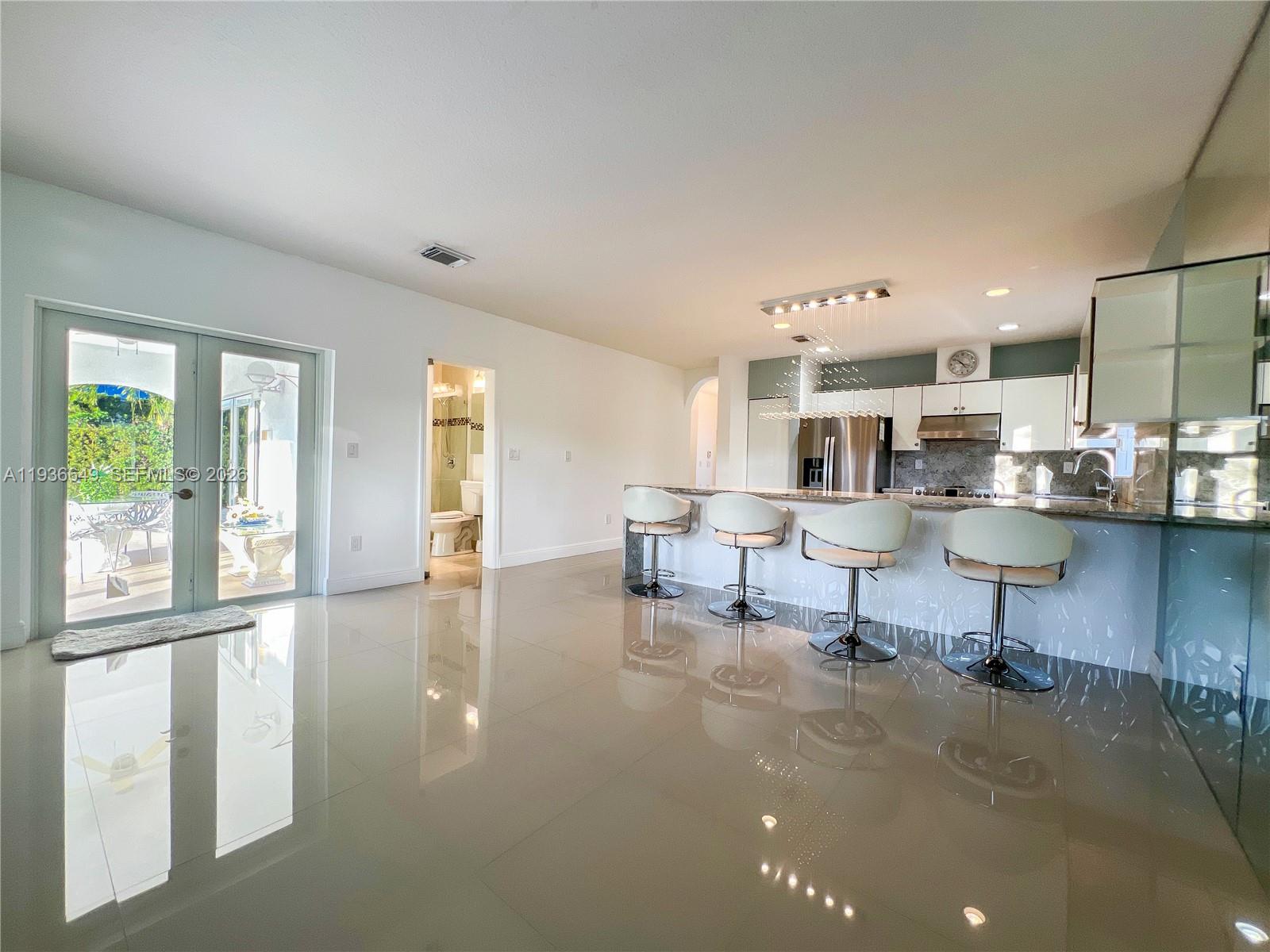 3884 Southwest 150th Court Miami, FL 33185 - Photo 17 of 45 a living room with furniture and a table