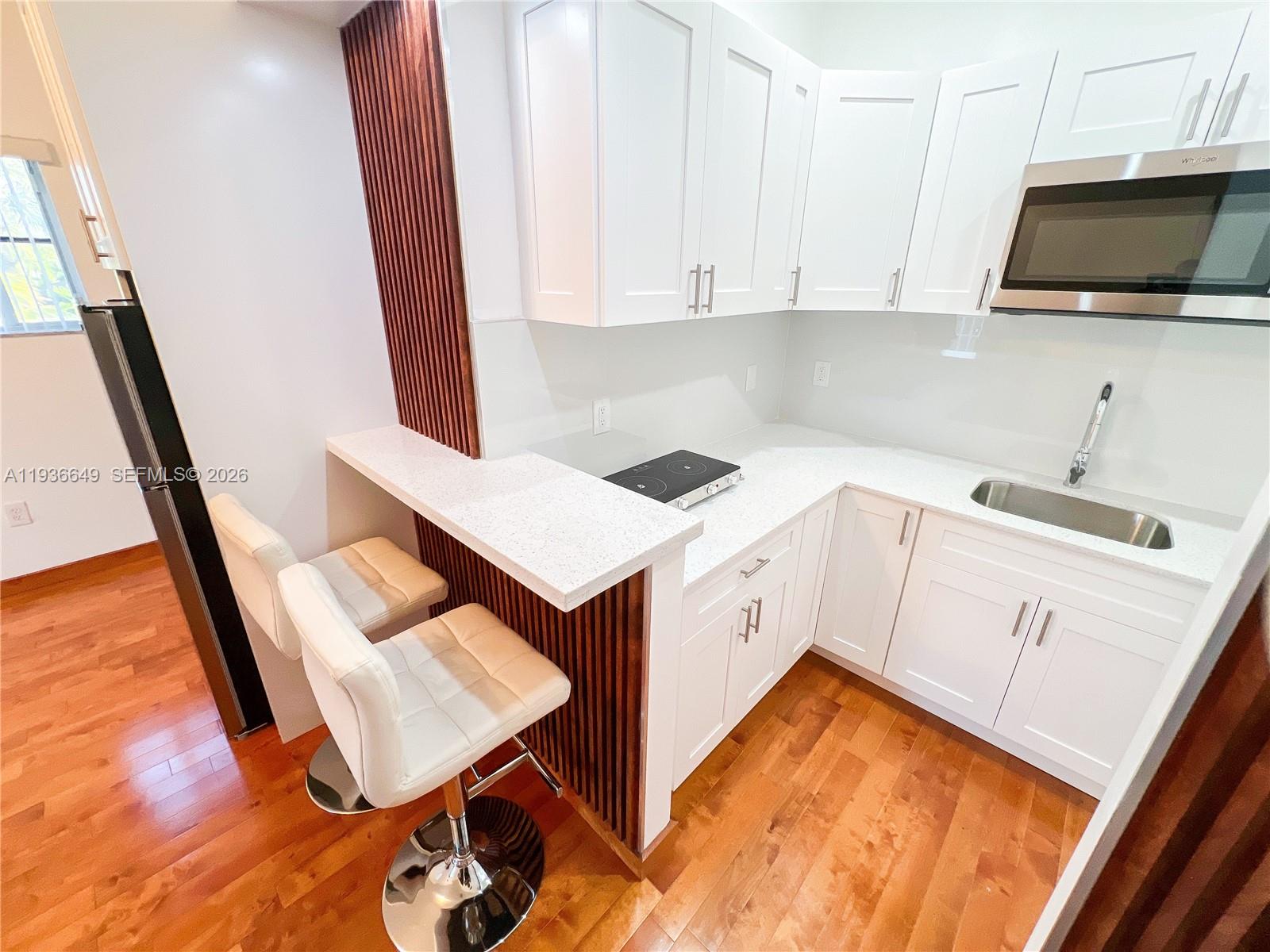 3884 Southwest 150th Court Miami, FL 33185 - Photo 29 of 45 a view of kitchen with sink and cabinets