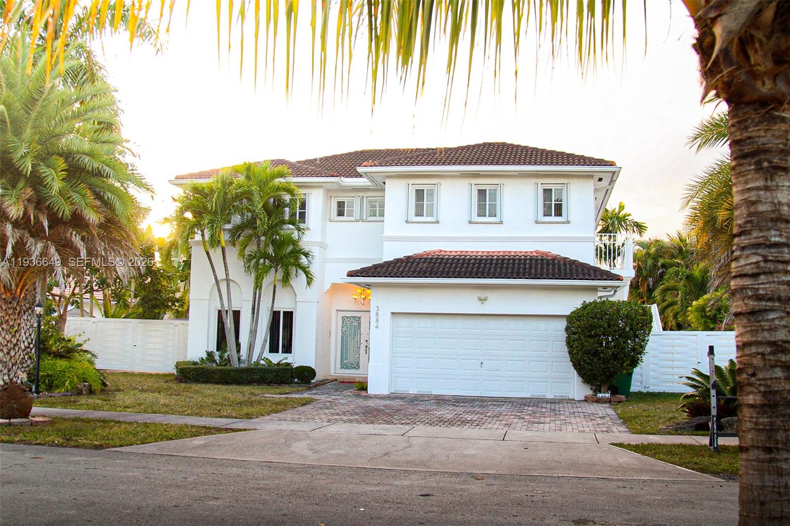 3884 Southwest 150th Court Miami, FL 33185 - Photo 3 of 45 a front view of a house with a garden and plants