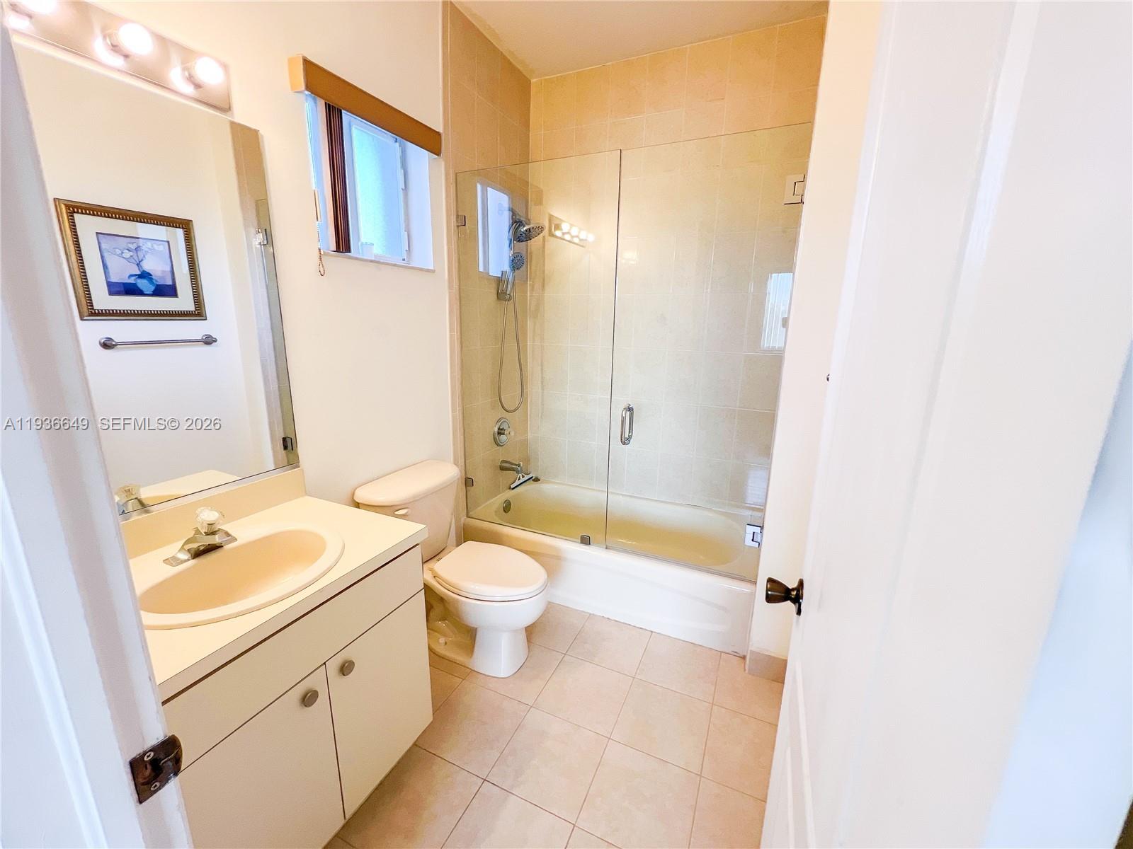 3884 Southwest 150th Court Miami, FL 33185 - Photo 32 of 45 a bathroom with a sink a toilet and shower