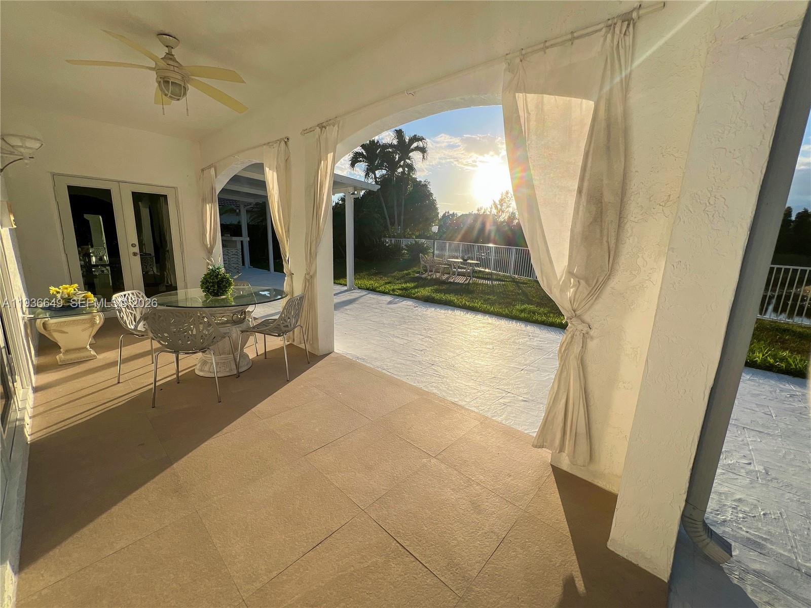 3884 Southwest 150th Court Miami, FL 33185 - Photo 37 of 45 a view of living room with furniture and floor to ceiling window