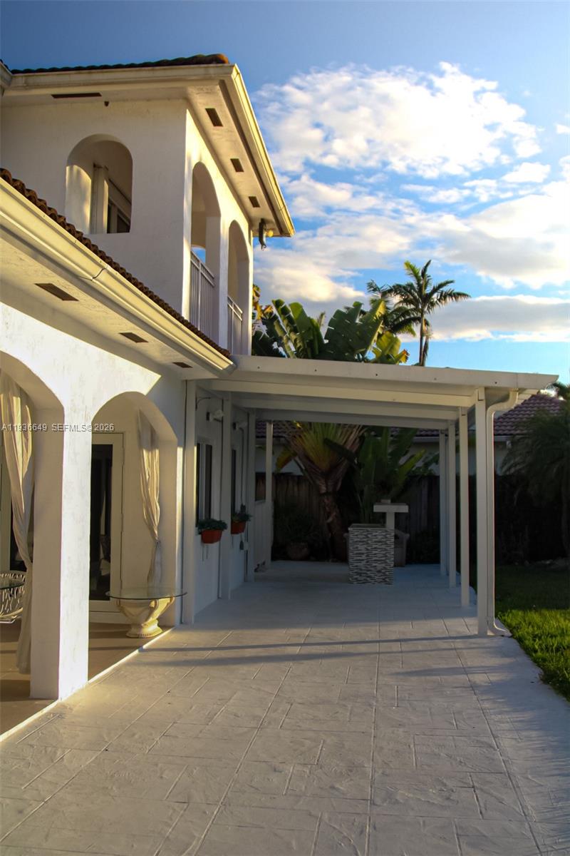 3884 Southwest 150th Court Miami, FL 33185 - Photo 39 of 45 a front view of a house with a yard