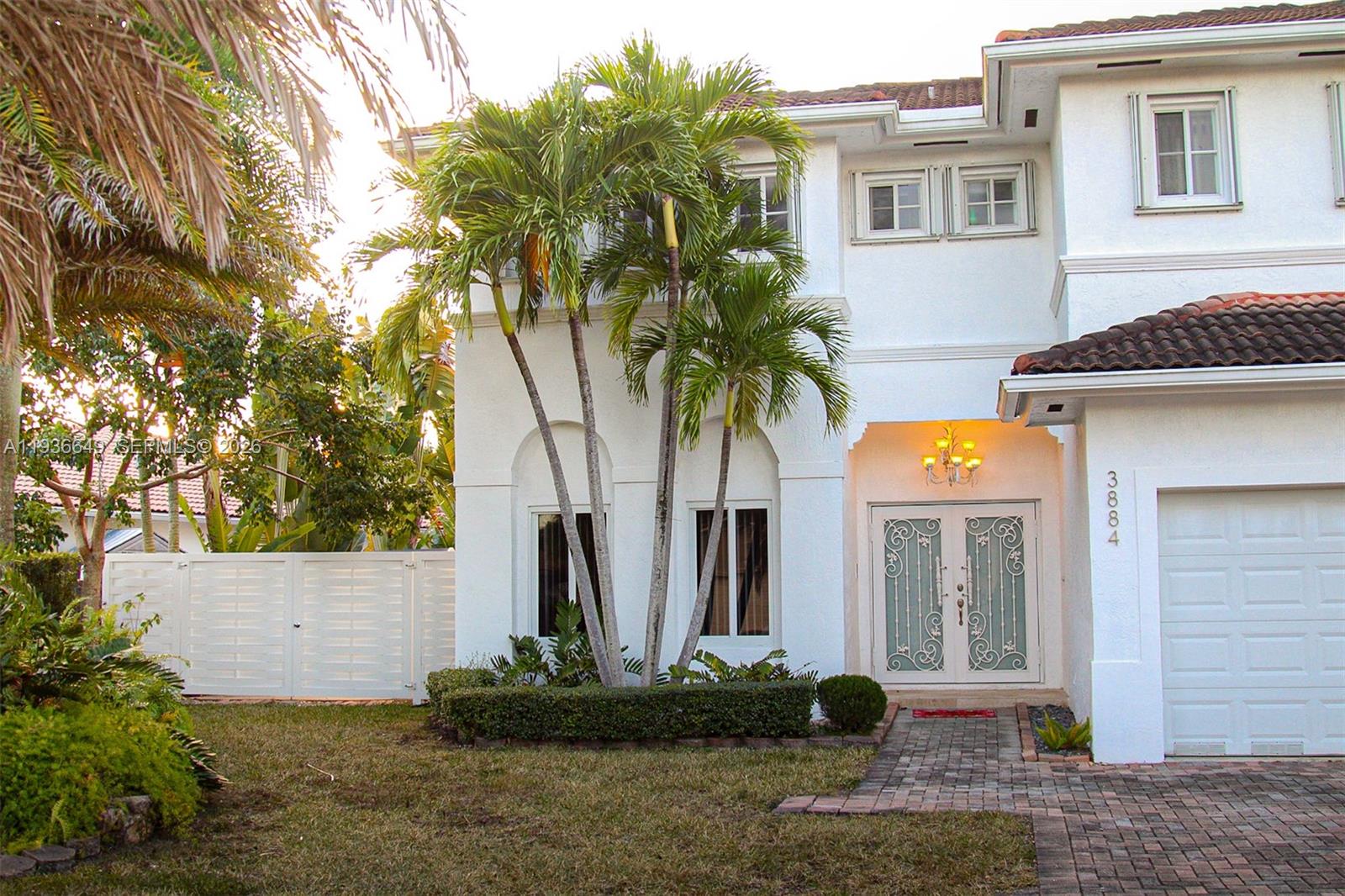 3884 Southwest 150th Court Miami, FL 33185 - Photo 4 of 45 a front view of a house with a yard