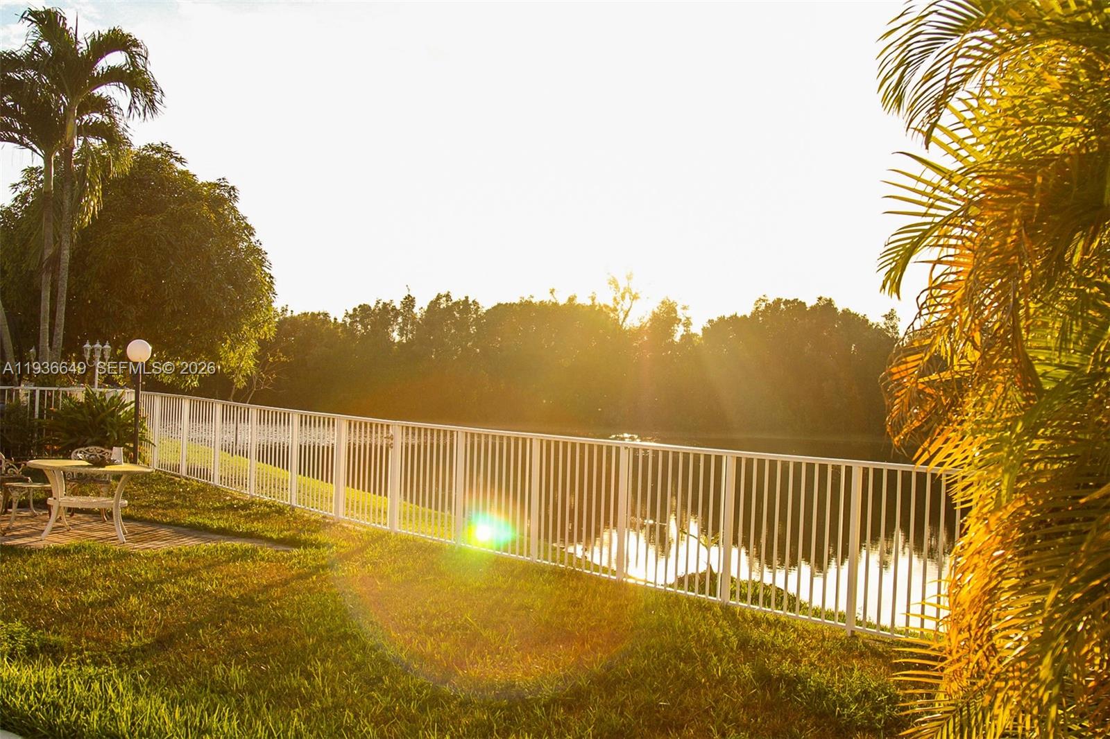 3884 Southwest 150th Court Miami, FL 33185 - Photo 42 of 45 a view of a swimming pool with a lounge chair