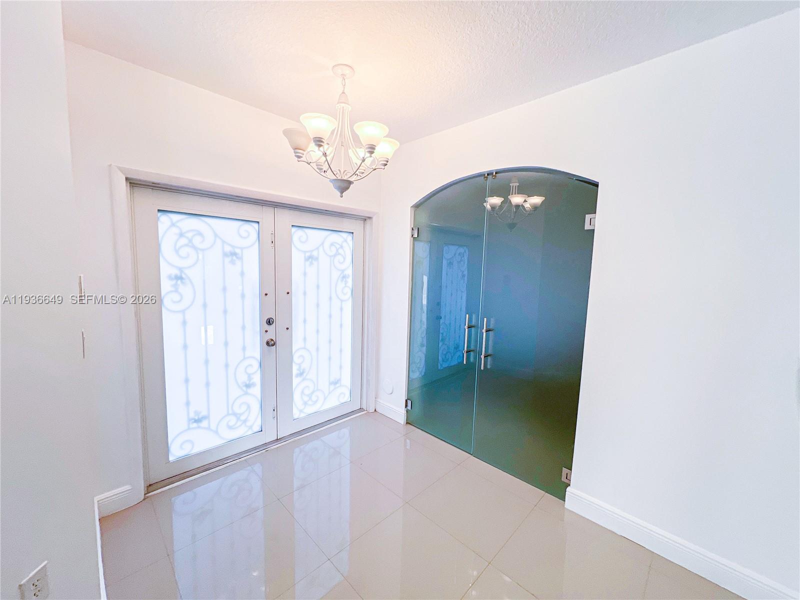 3884 Southwest 150th Court Miami, FL 33185 - Photo 9 of 45 en view of a big room with a chandelier fan