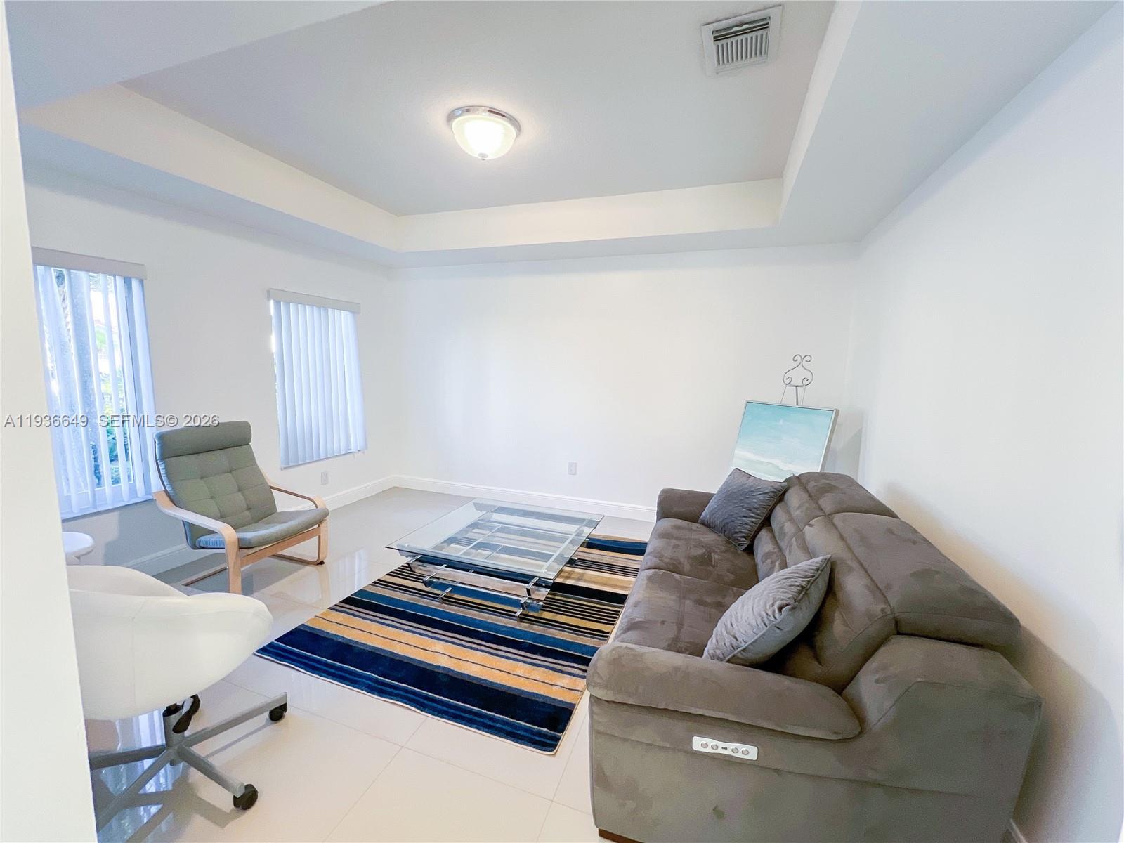 3884 Southwest 150th Court Miami, FL 33185 - Photo 10 of 45 a living room with furniture and a couch