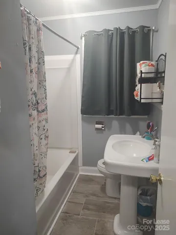 a living room with furniture a lamp and a fireplace