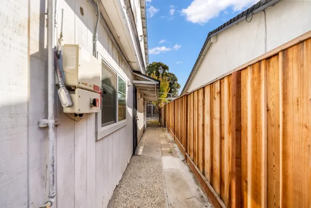 a view of a balcony with wooden floor