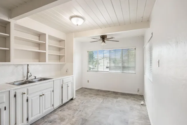 a view of a kitchen with electric appliances