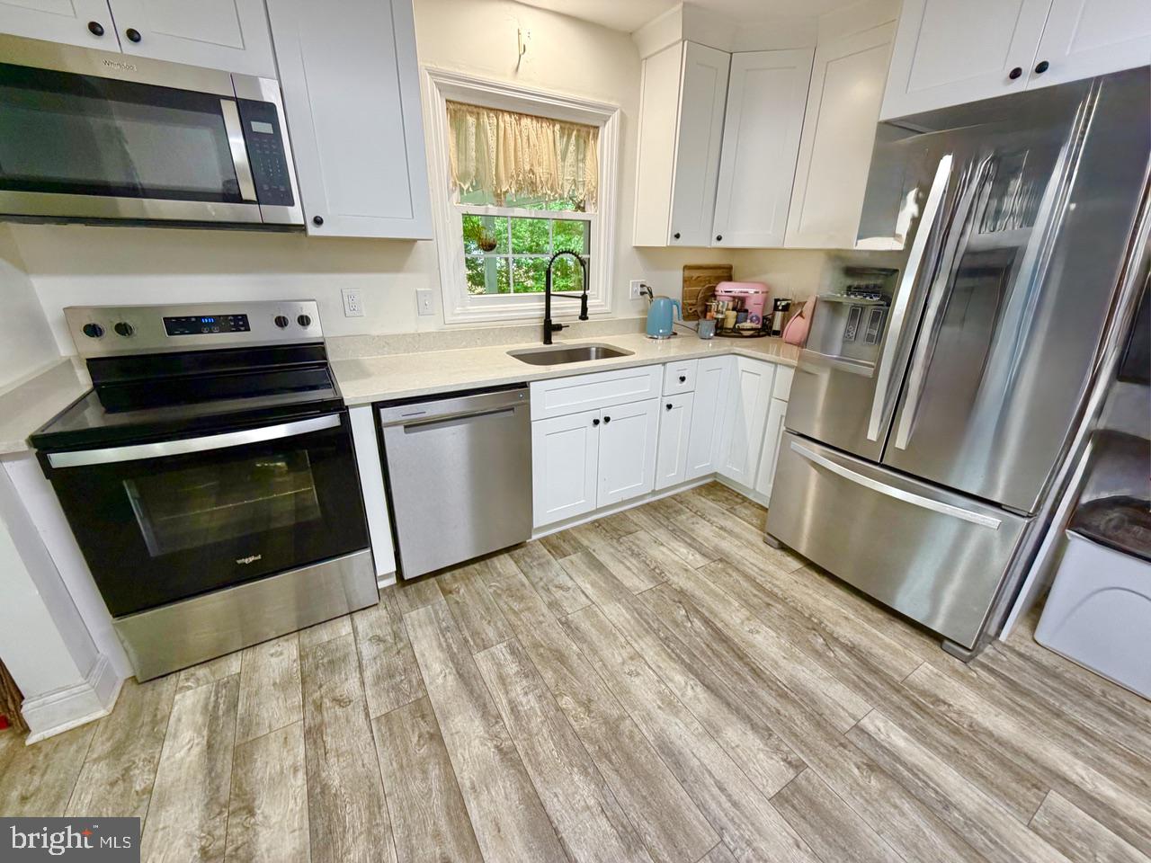 2413 Shelburn Road Millville, NJ 08332 - Photo 12 of 41 a kitchen with a refrigerator stove and microwave