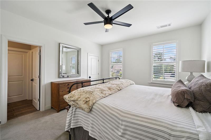 2755 Rustic Lk Terrace Cumming, GA 30041 - Photo 106 of 141 a bedroom with a bed and a large window