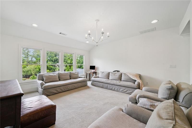 2755 Rustic Lk Terrace Cumming, GA 30041 - Photo 109 of 141 a living room with furniture and a large window