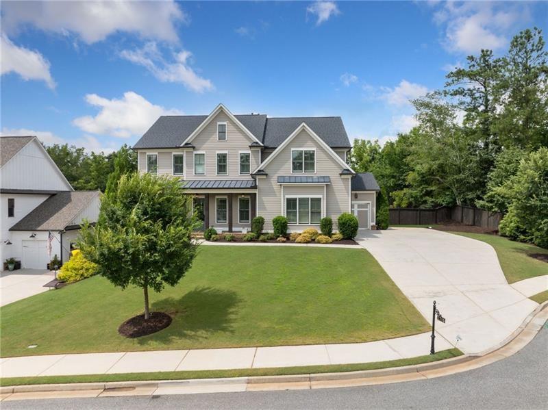 2755 Rustic Lk Terrace Cumming, GA 30041 - Photo 3 of 141 a front view of a house with a yard