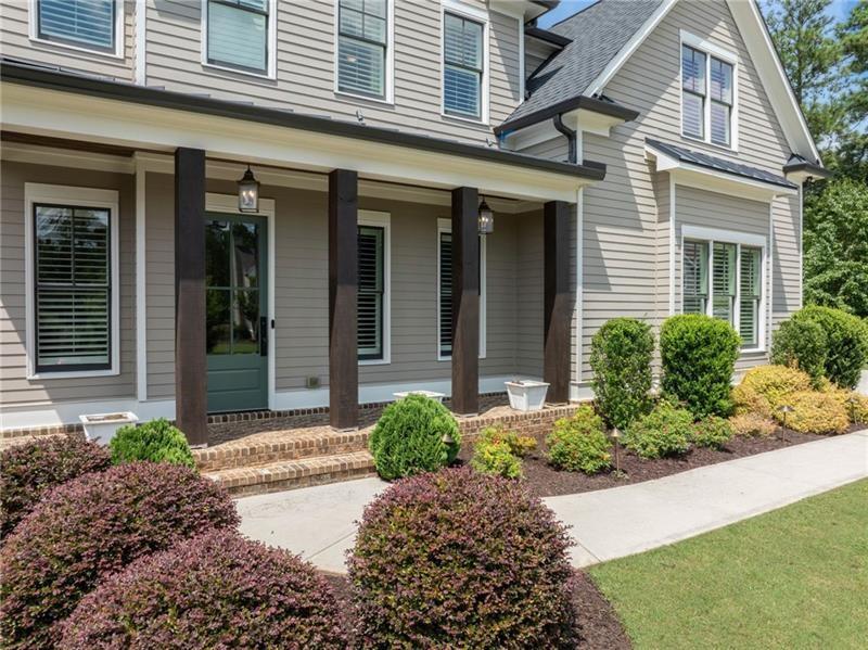 2755 Rustic Lk Terrace Cumming, GA 30041 - Photo 4 of 141 front view of a brick house with a yard