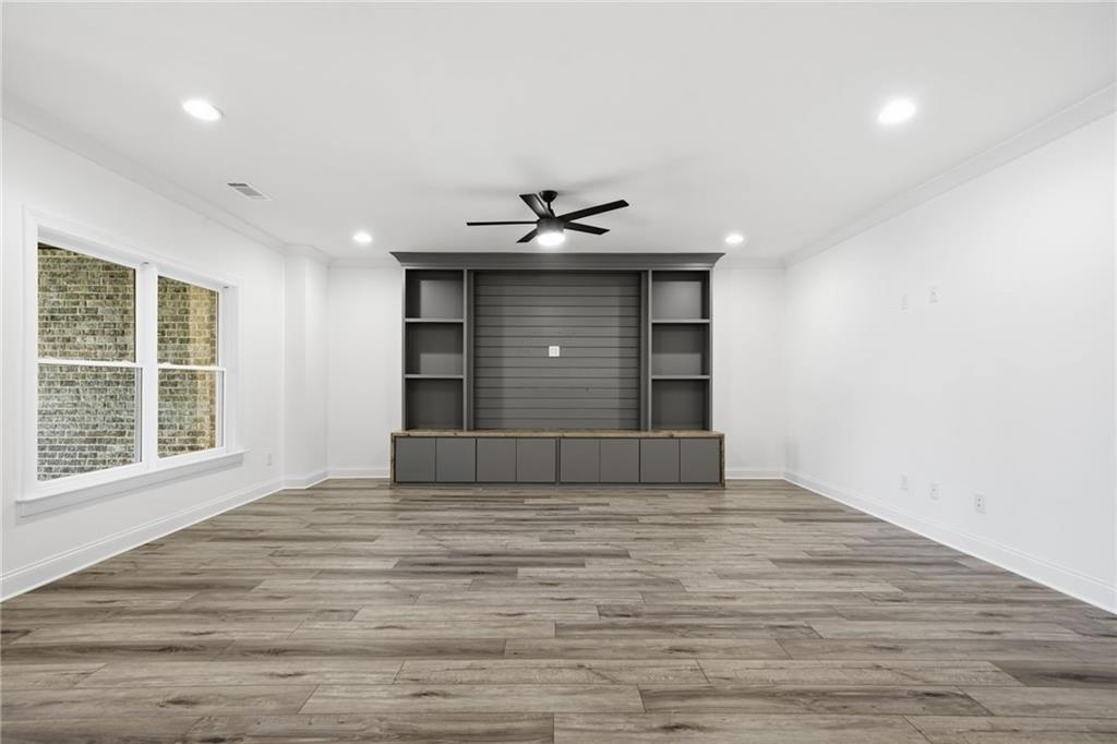 2755 Rustic Lk Terrace Cumming, GA 30041 - Photo 68 of 141 a view of an empty room with a window and a kitchen