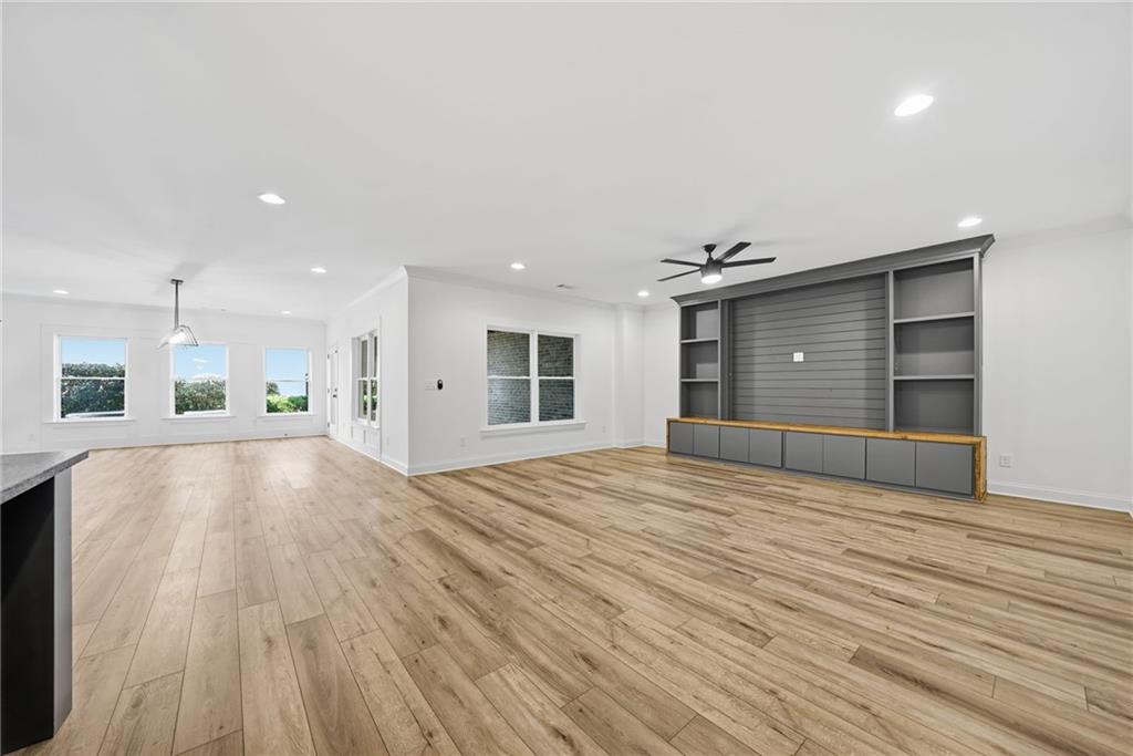 2755 Rustic Lk Terrace Cumming, GA 30041 - Photo 70 of 141 a view of an empty room with wooden floor and a window