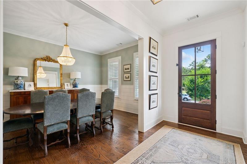 2755 Rustic Lk Terrace Cumming, GA 30041 - Photo 75 of 141 a view of a dining room with furniture window and wooden floor