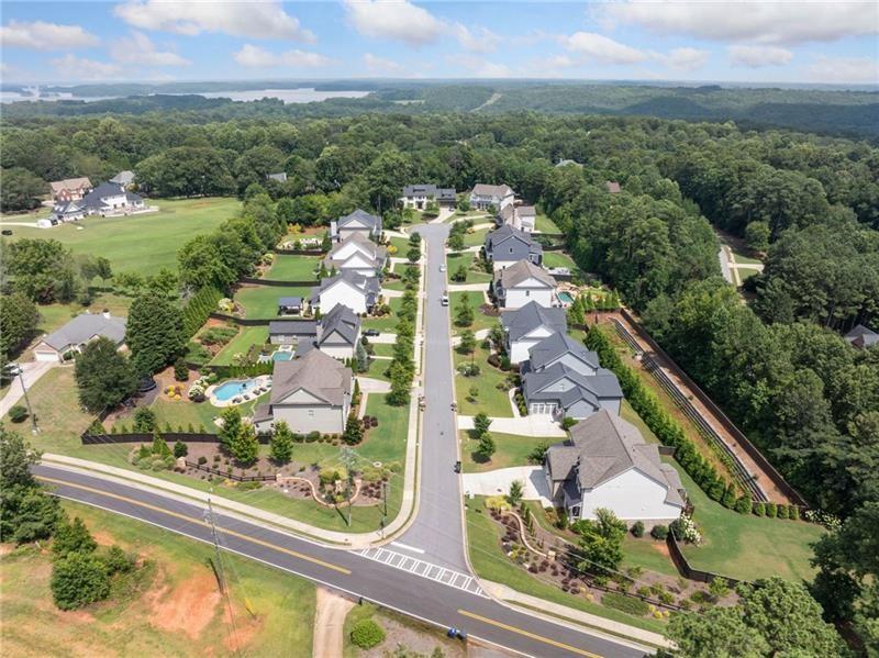 2755 Rustic Lk Terrace Cumming, GA 30041 - Photo 10 of 141 an aerial view of residential houses with outdoor space and trees