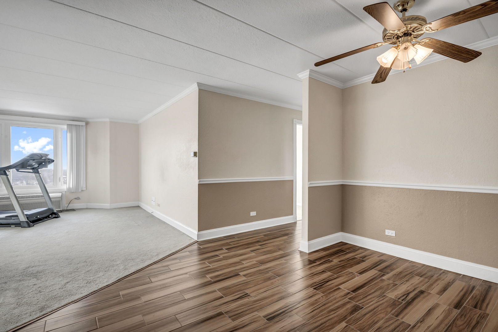 1 Renaissance Place, Unit 911 Palatine, IL 60067 - Photo 5 of 17 wooden floor in an empty room with a window