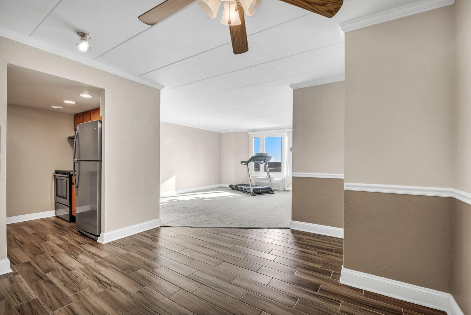 1 Renaissance Place, Unit 911 Palatine, IL 60067 - Photo 7 of 17 a view of a refrigerator in kitchen and wooden floor