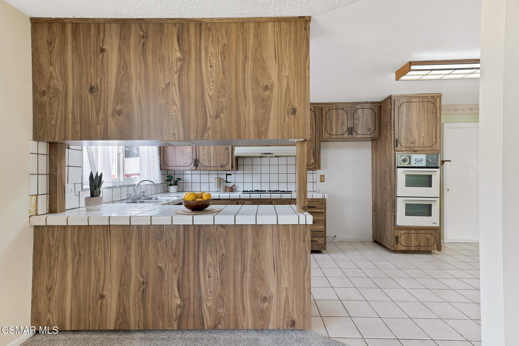 3235 Amarillo Avenue Simi Valley, CA 93063 - Photo 17 of 61 a kitchen with stainless steel appliances a refrigerator and a sink