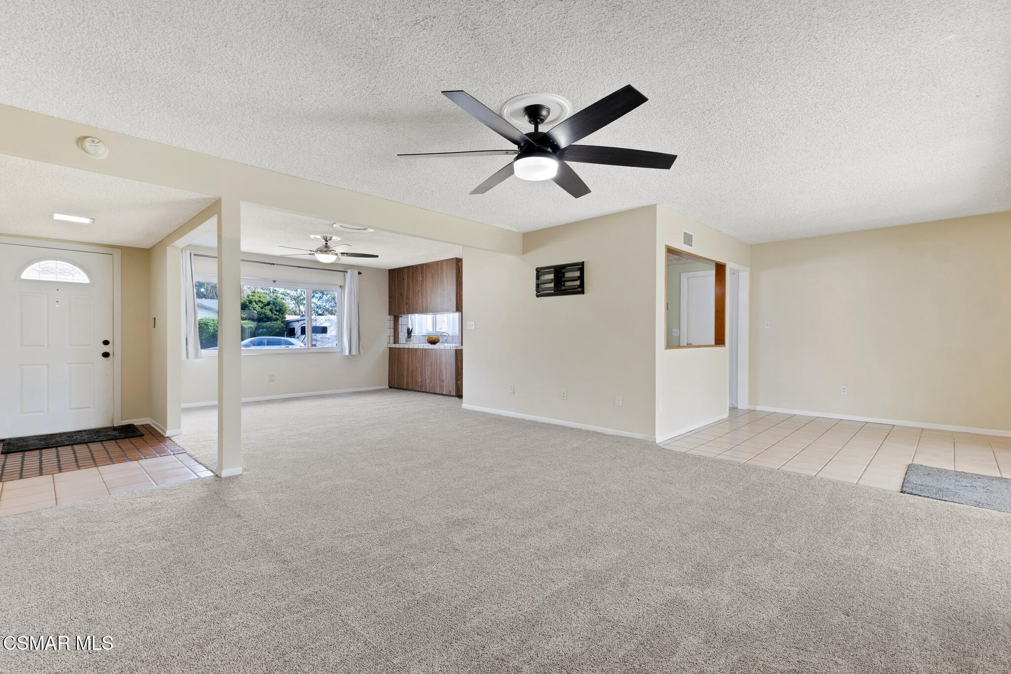 3235 Amarillo Avenue Simi Valley, CA 93063 - Photo 9 of 61 a view of a livingroom with a ceiling fan and window