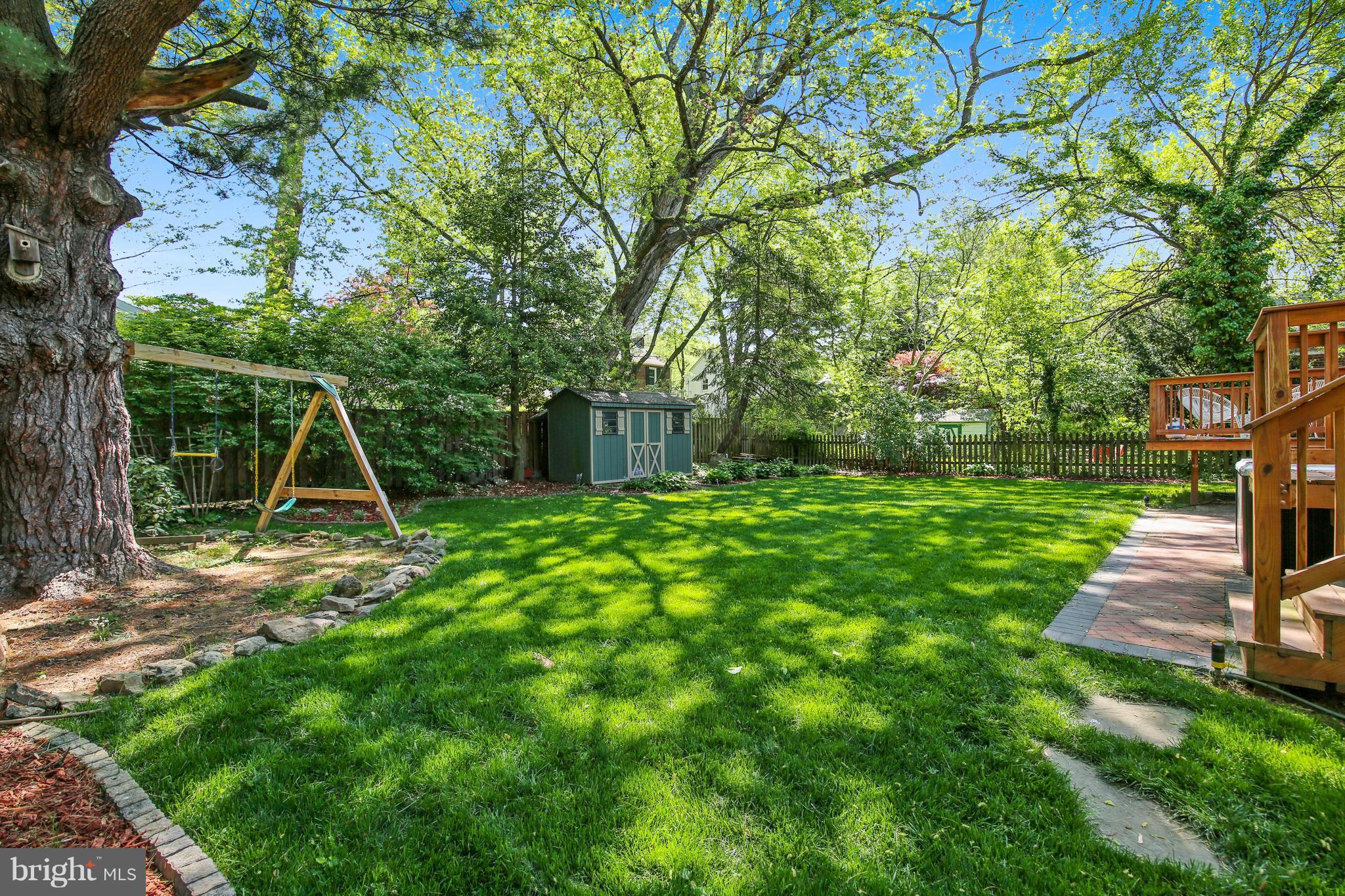 9129 Bradford Road Silver Spring, MD 20901 - Photo 16 of 26 a view of a house with backyard and a tree