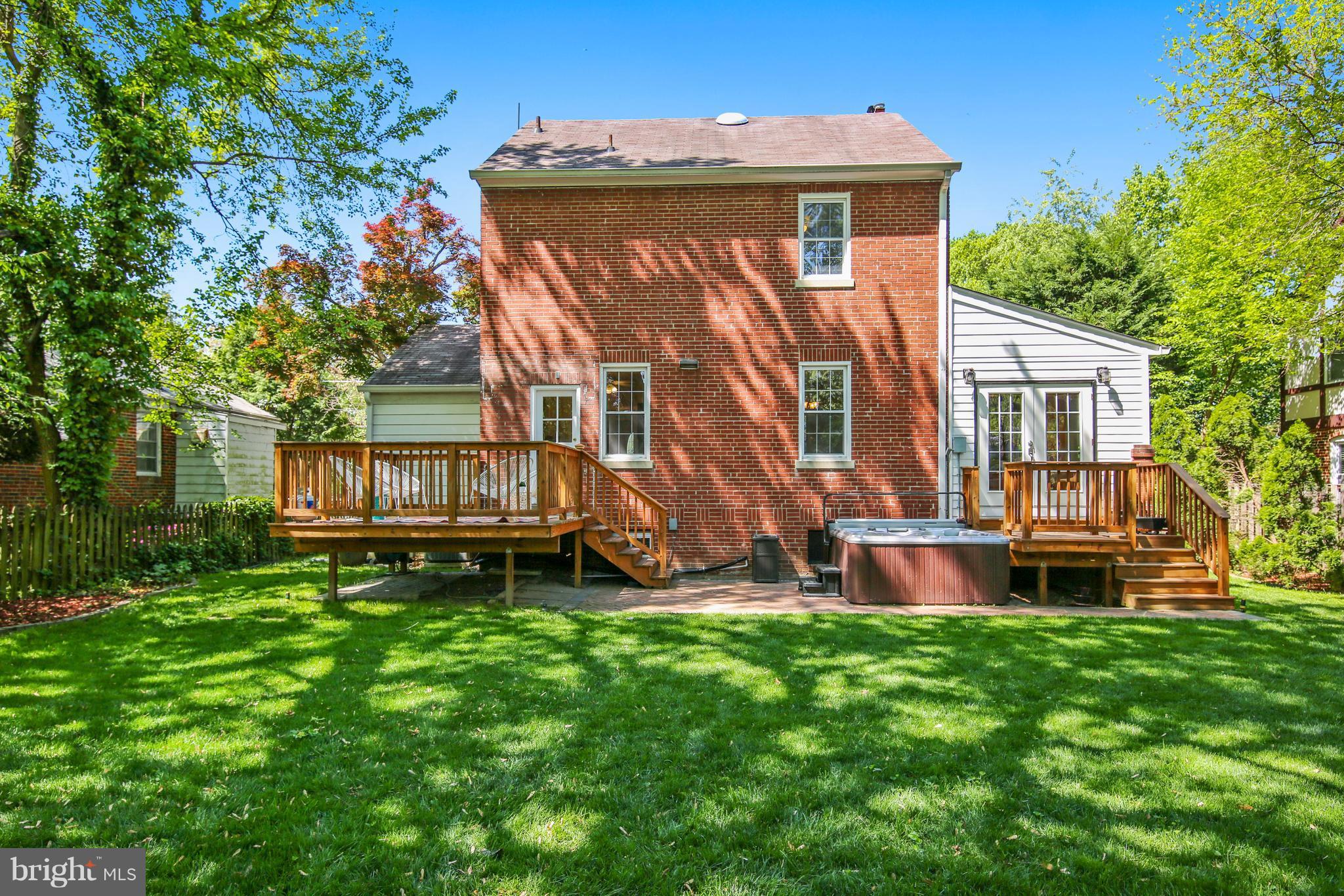 9129 Bradford Road Silver Spring, MD 20901 - Photo 18 of 26 a view of a house with a yard and sitting area