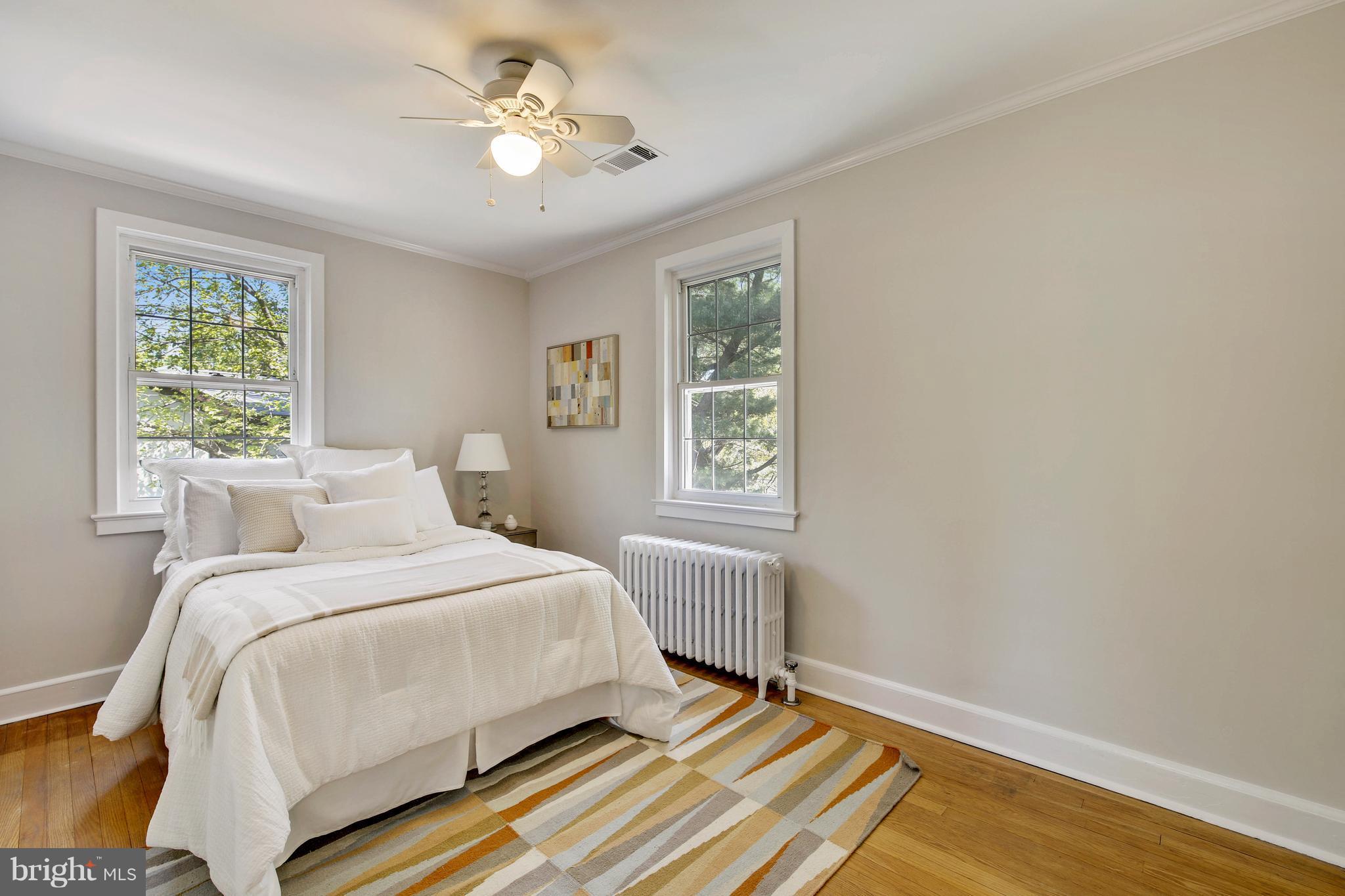 9129 Bradford Road Silver Spring, MD 20901 - Photo 23 of 26 a bedroom with a bed and a window