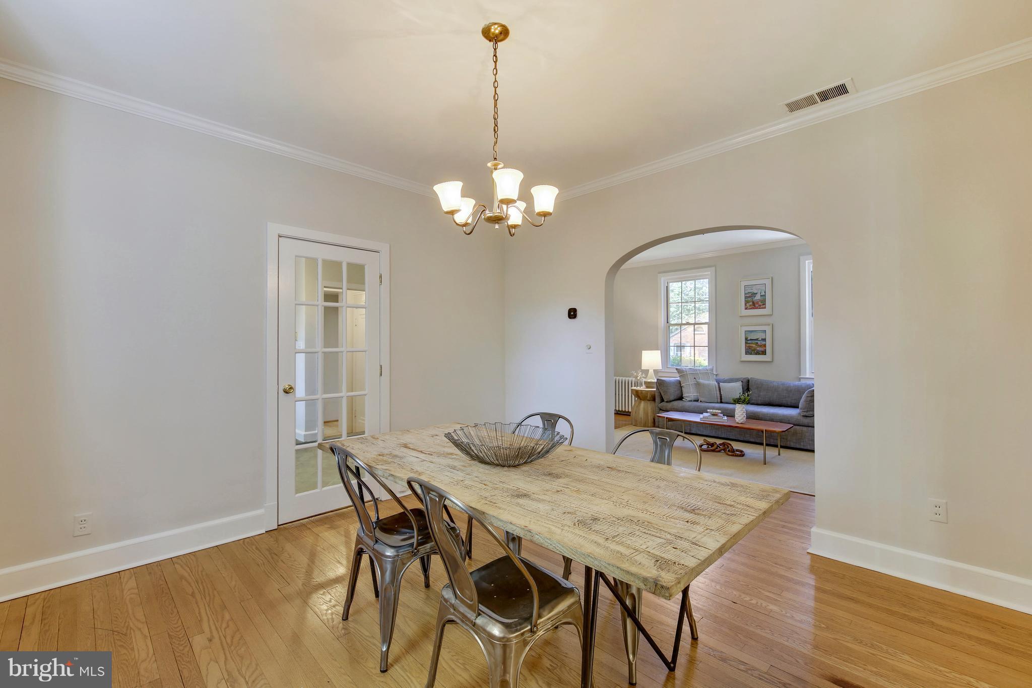 9129 Bradford Road Silver Spring, MD 20901 - Photo 7 of 26 a view of a dining room with furniture and wooden floor