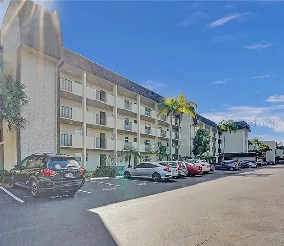 a city street lined with buildings and cars