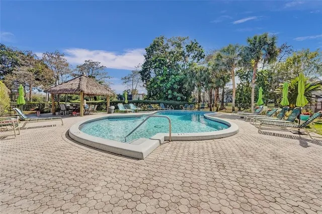 a view of a swimming pool with a lounge chairs