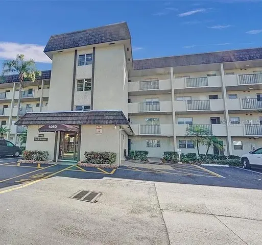 a front view of a building with garage