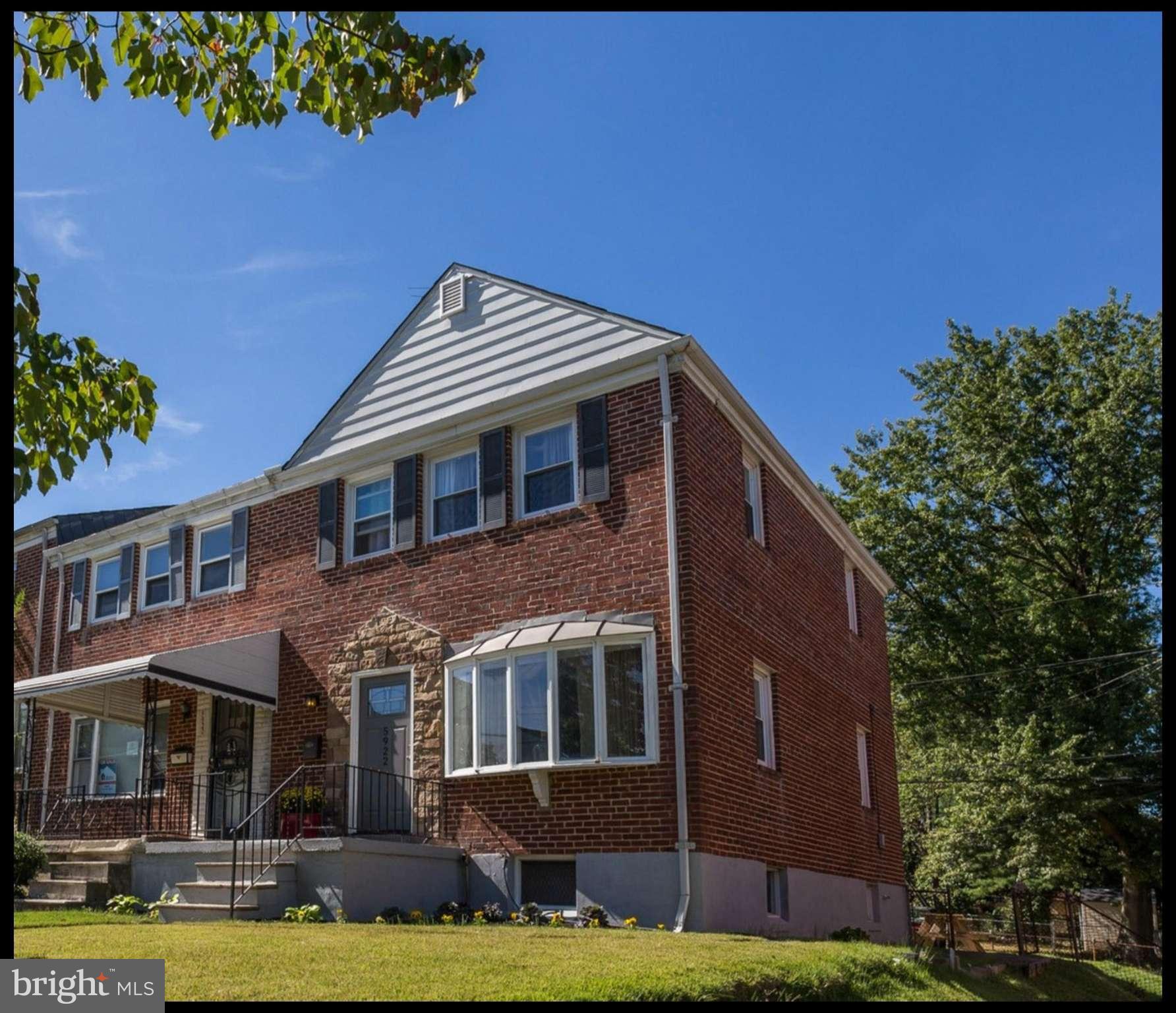 5922 Hillen Road Baltimore, MD 21239 - Photo 1 of 24 a front view of a house with garden