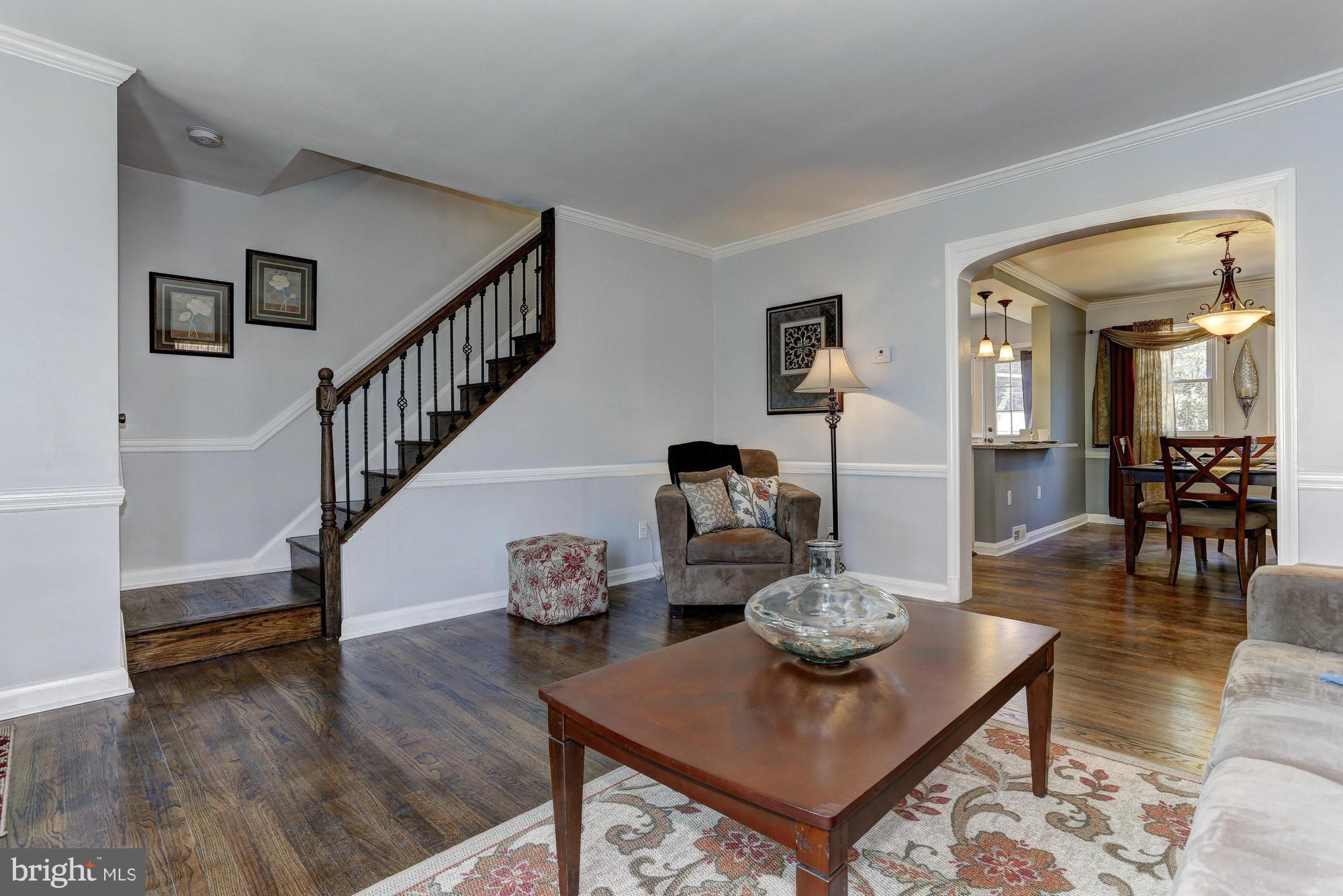 5922 Hillen Road Baltimore, MD 21239 - Photo 3 of 24 a living room with furniture and a table