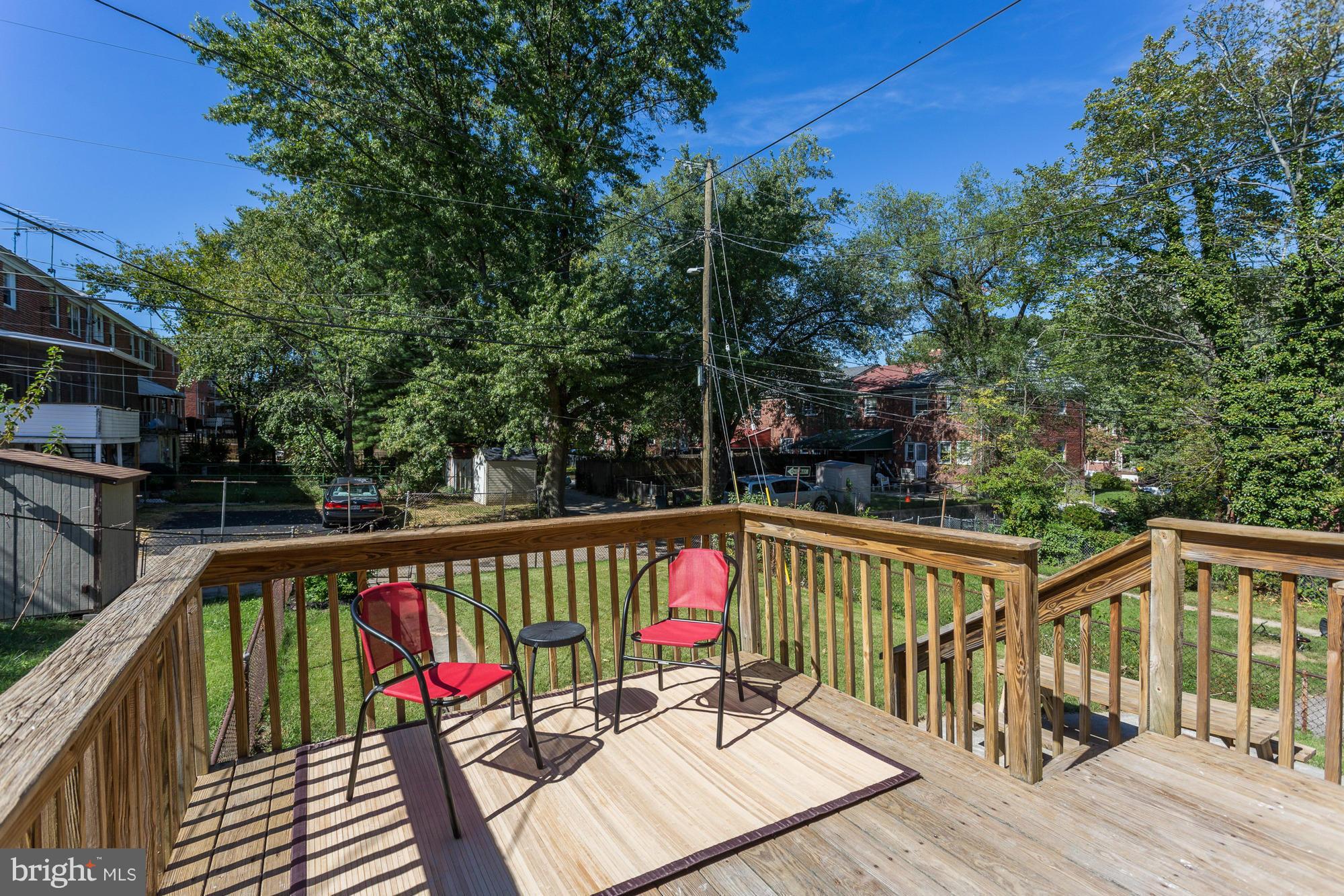 5922 Hillen Road Baltimore, MD 21239 - Photo 21 of 24 a view of balcony with wooden floor and outdoor seating