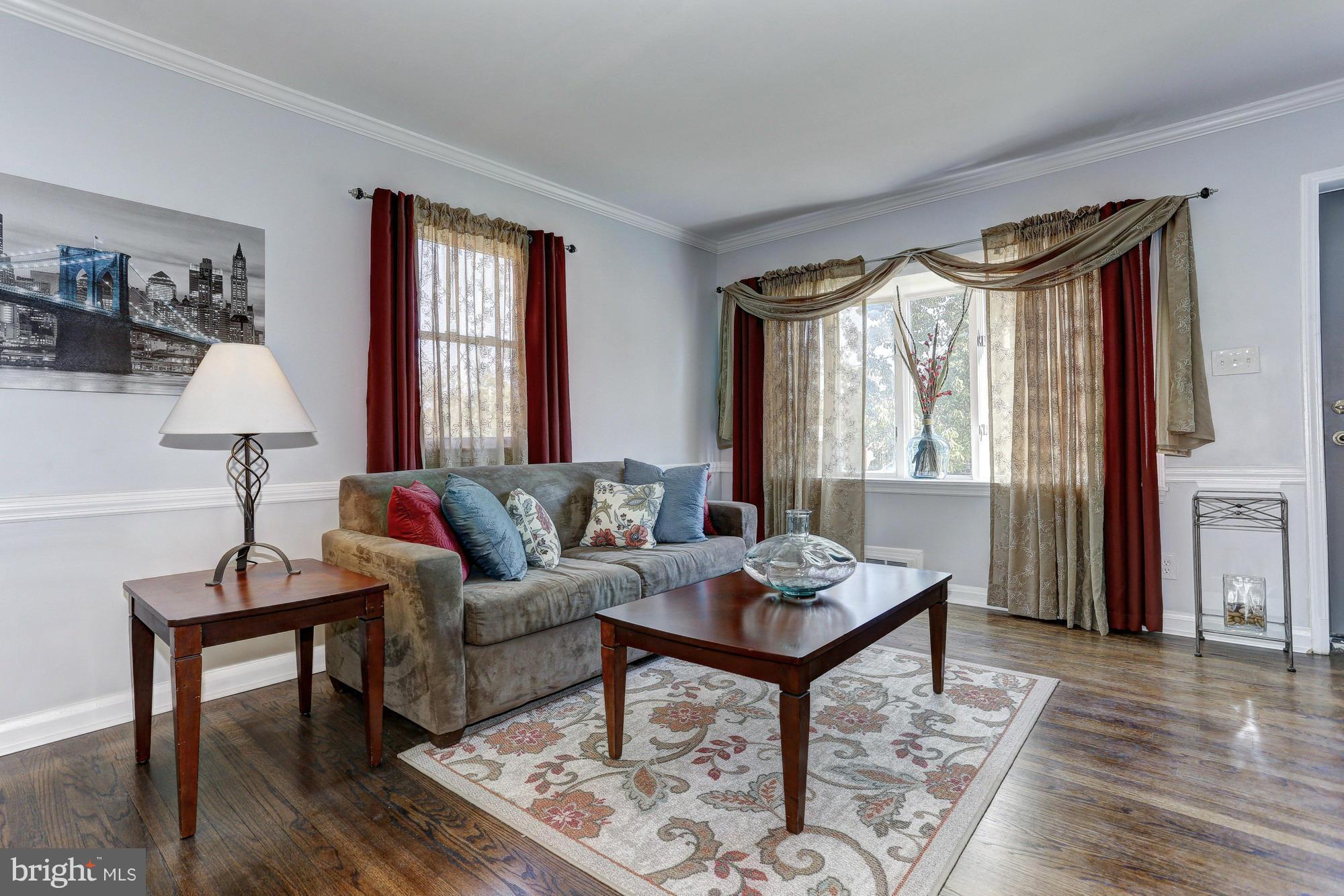 5922 Hillen Road Baltimore, MD 21239 - Photo 4 of 24 a living room with furniture and a window