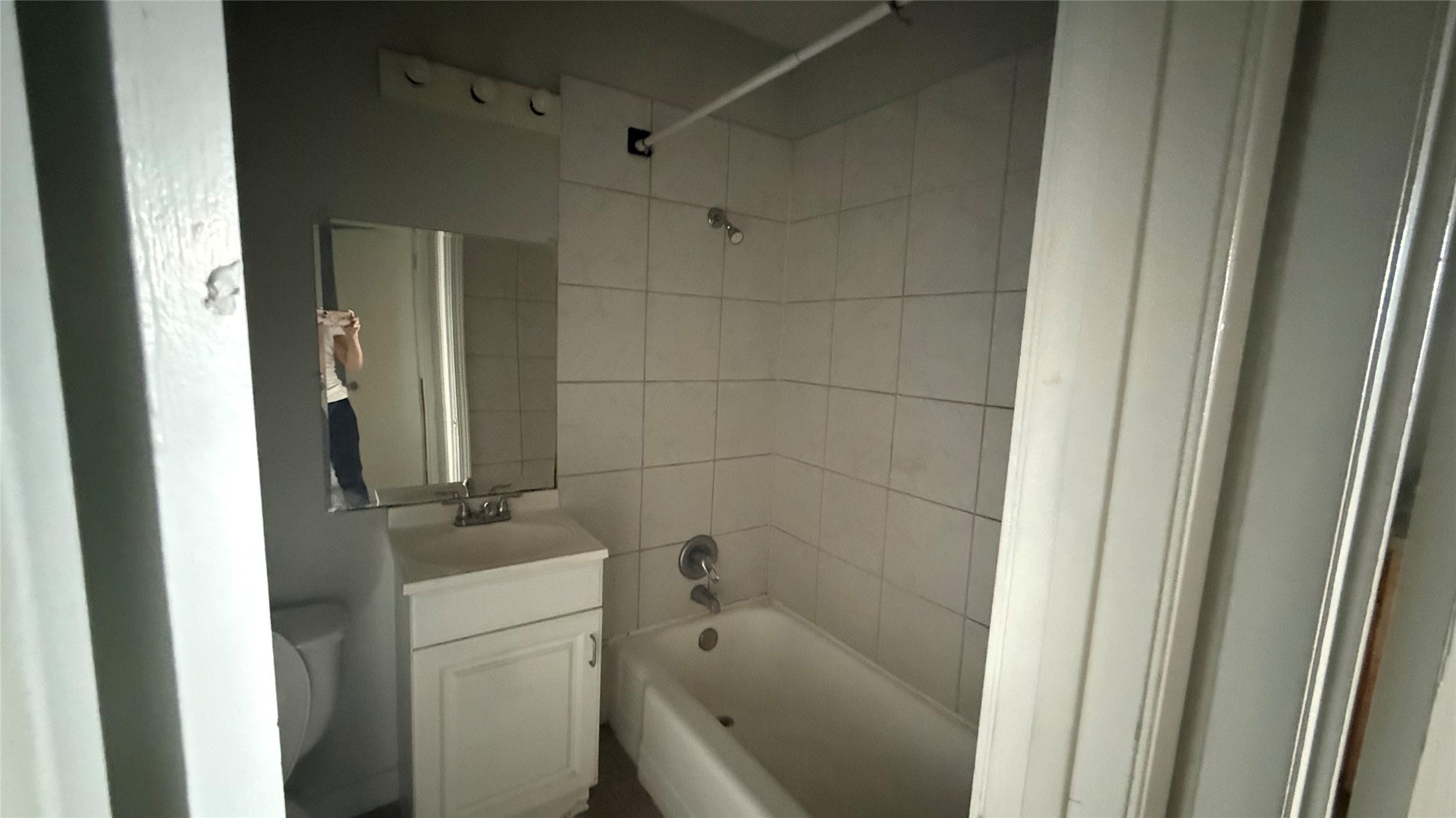 1849 Richmond Avenue, Unit 48 Houston, TX 77098 - Photo 6 of 7 a bathroom with a bathtub and a shower