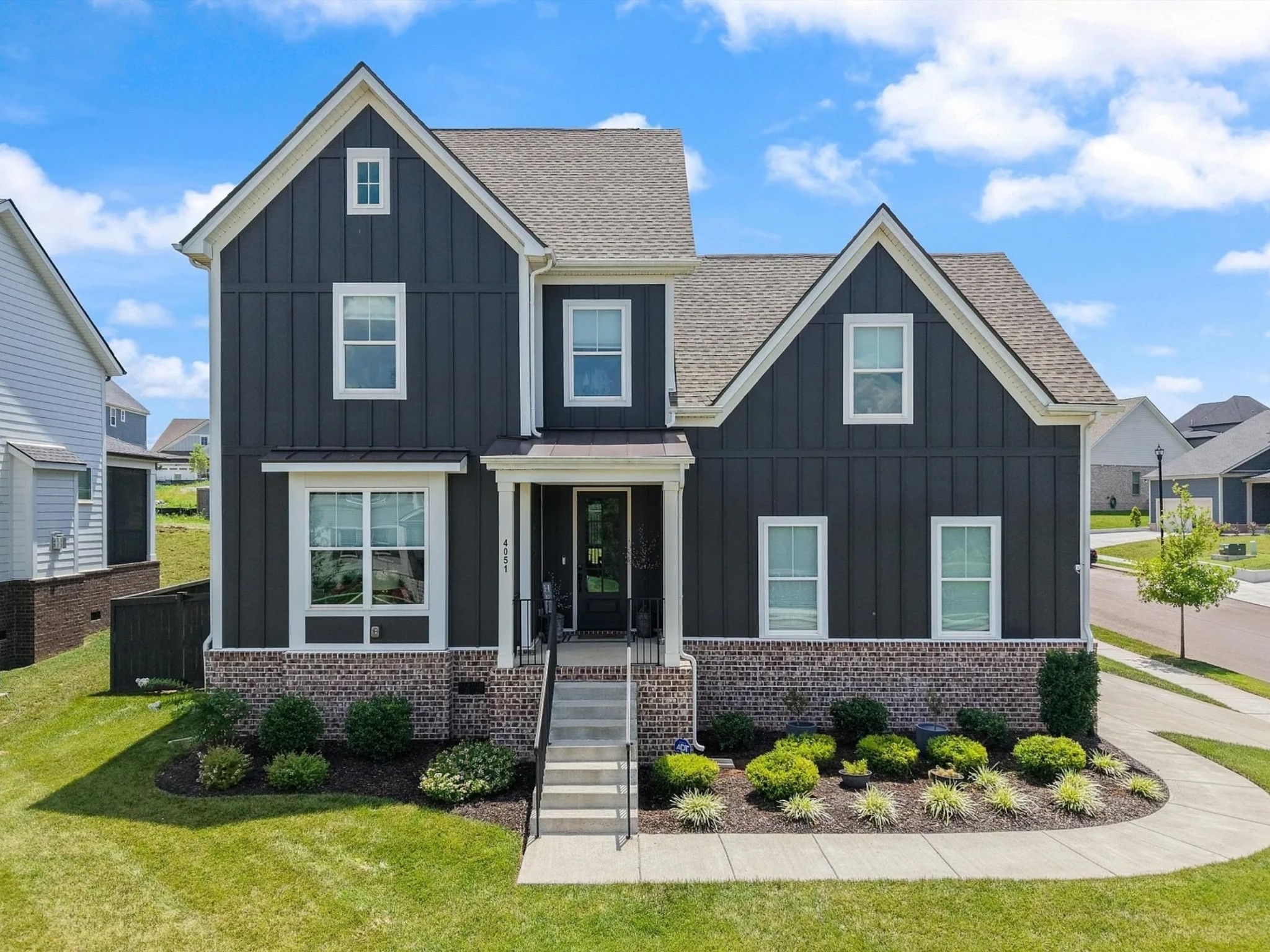 a front view of a house with a yard