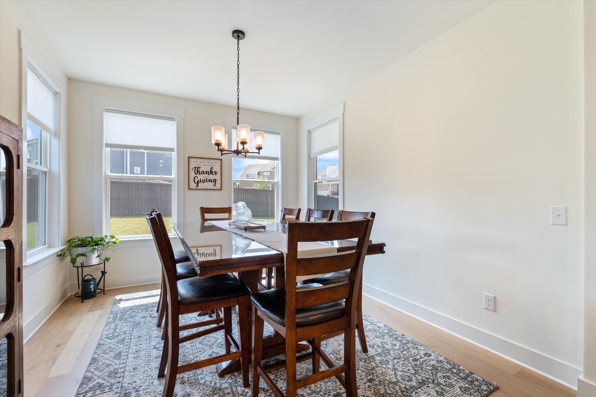 4051 John Marsh Road Spring Hill, TN 37174 - Photo 21 of 46 a view of a dining room with furniture window and wooden floor