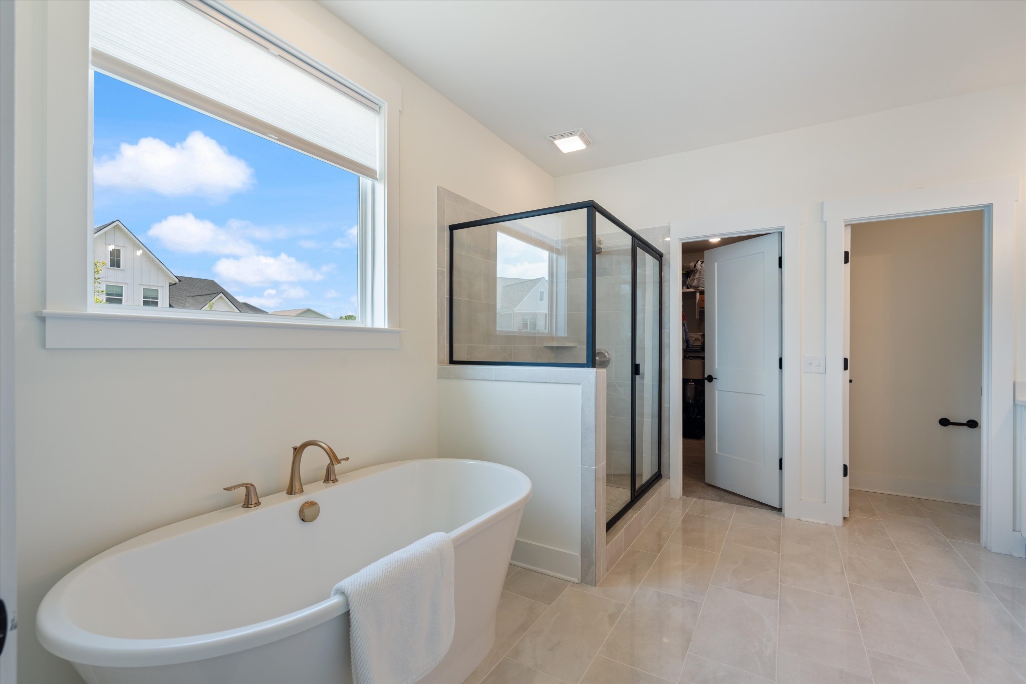 4051 John Marsh Road Spring Hill, TN 37174 - Photo 25 of 46 a white bath tub sitting next to a white sink