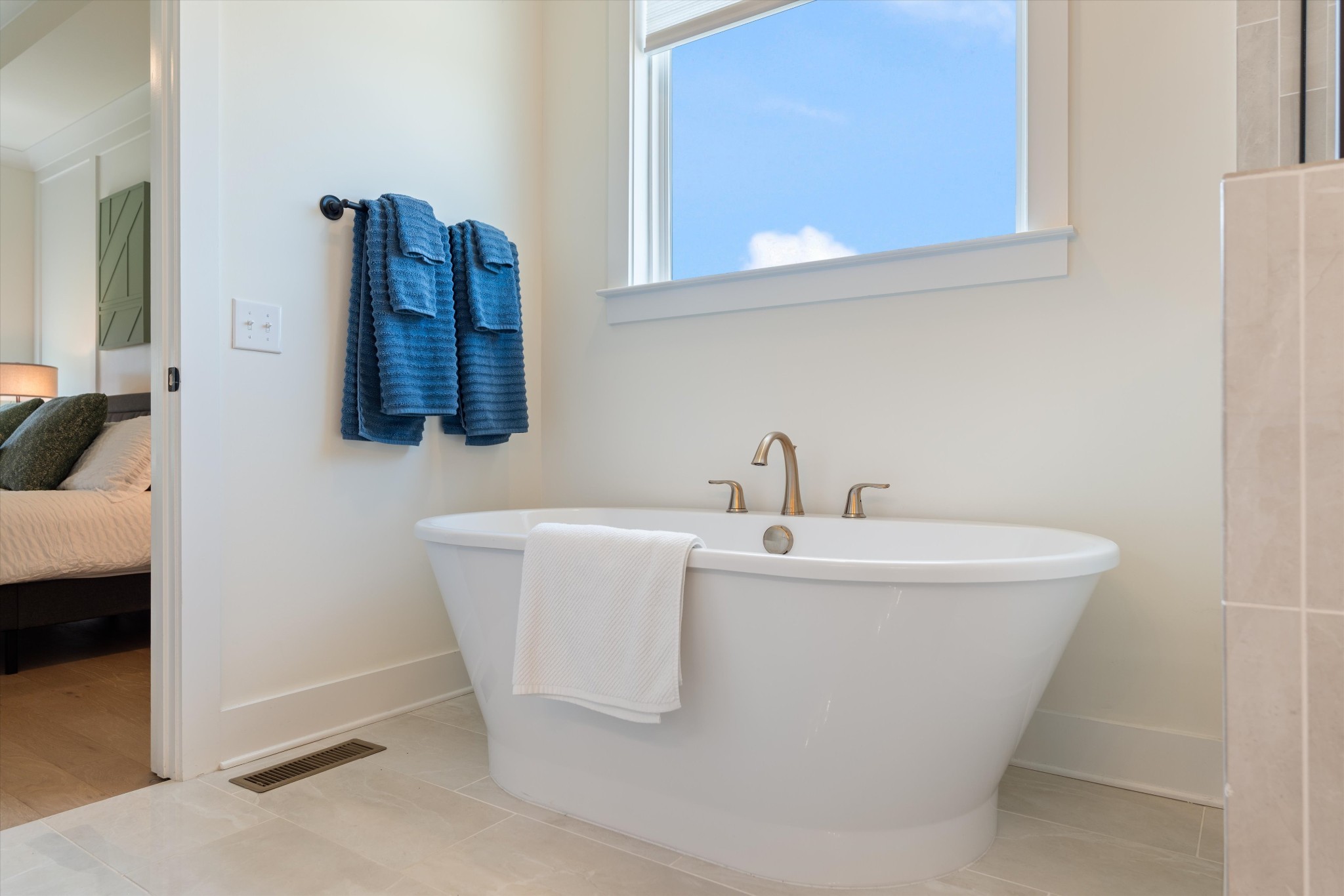 4051 John Marsh Road Spring Hill, TN 37174 - Photo 26 of 46 a white bath tub sitting in a bathroom