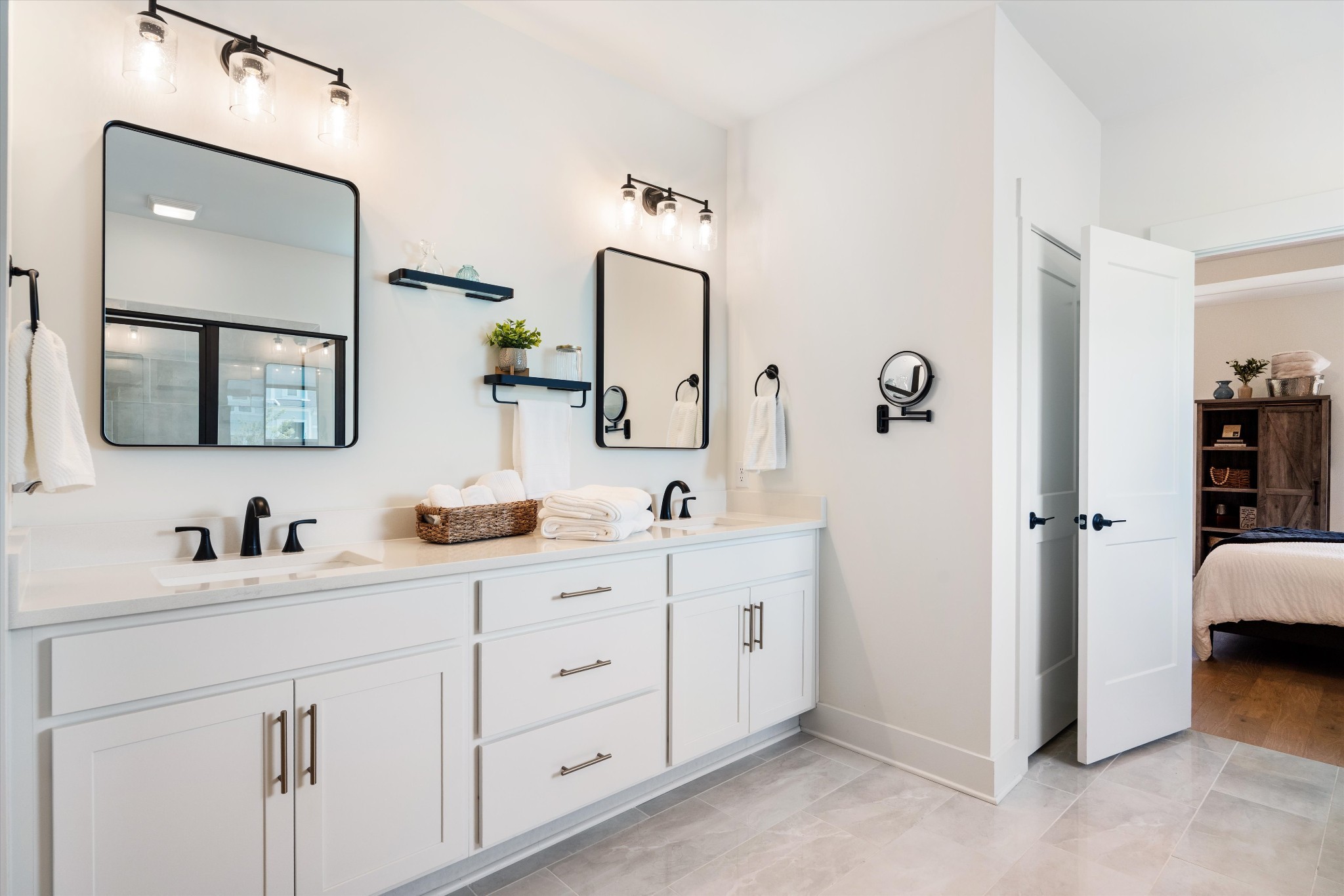 4051 John Marsh Road Spring Hill, TN 37174 - Photo 28 of 46 a en suite bathroom with double sink and a mirror