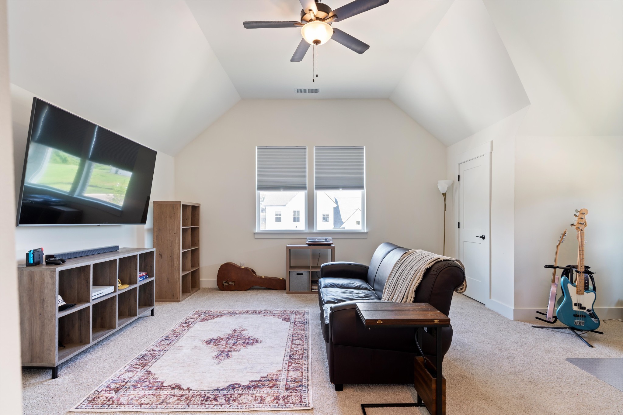 4051 John Marsh Road Spring Hill, TN 37174 - Photo 31 of 46 a living room with furniture and a flat screen tv