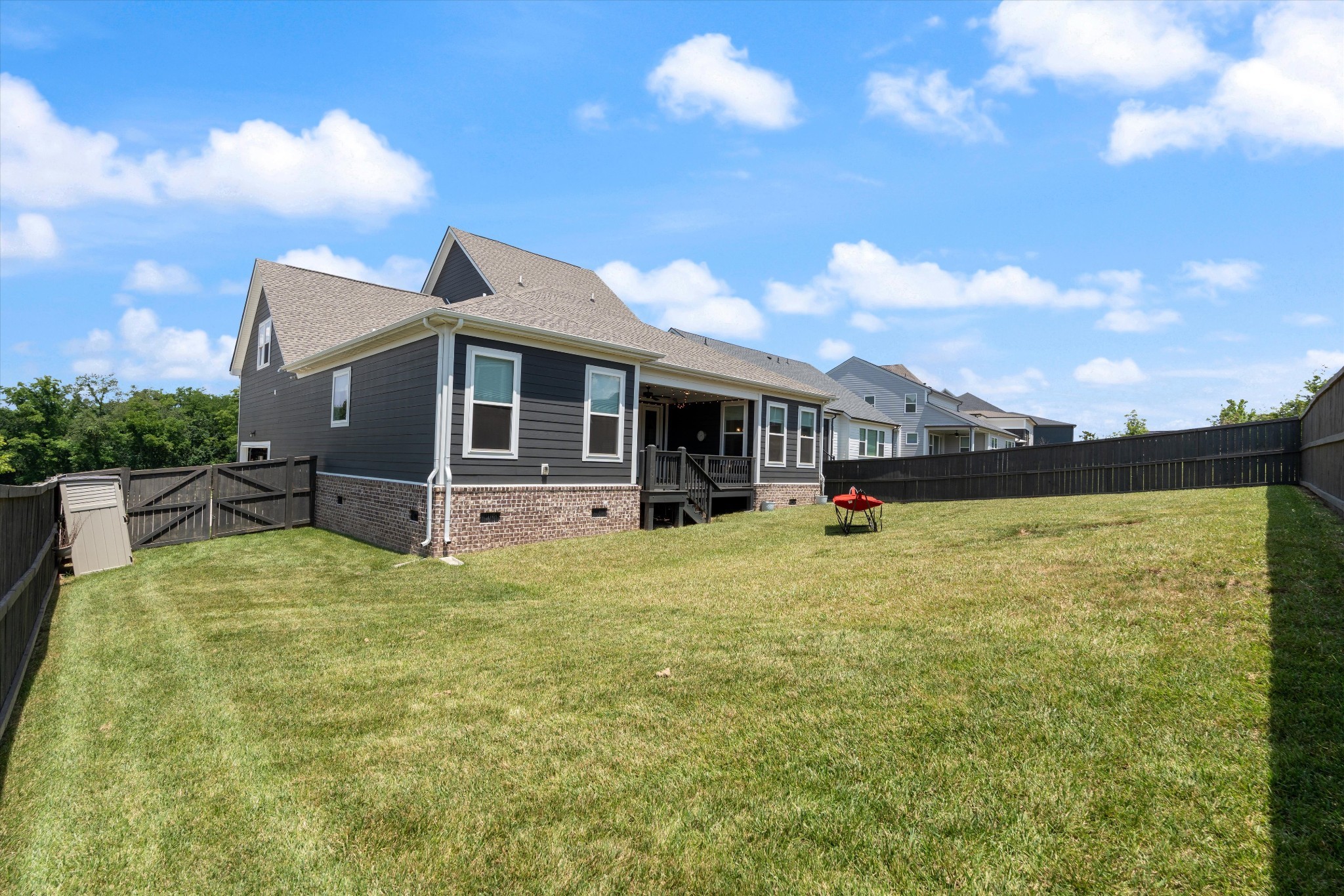 4051 John Marsh Road Spring Hill, TN 37174 - Photo 40 of 46 a backyard of a house with table and chairs