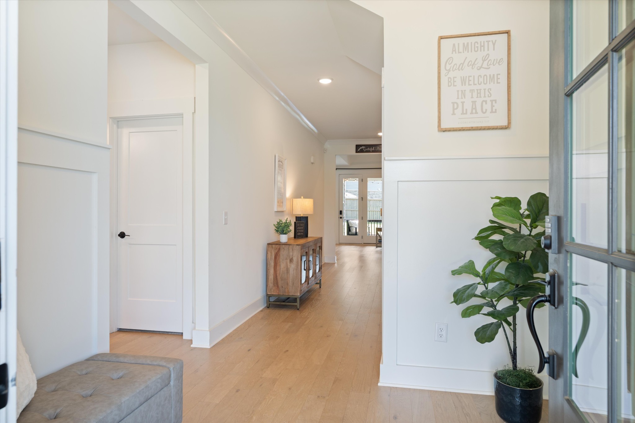 4051 John Marsh Road Spring Hill, TN 37174 - Photo 6 of 46 a view of a hallway with wooden floor and a potted plant