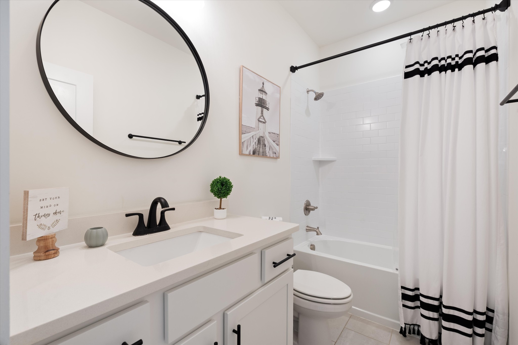 4051 John Marsh Road Spring Hill, TN 37174 - Photo 10 of 46 a bathroom with a sink a mirror a toilet and a mirror